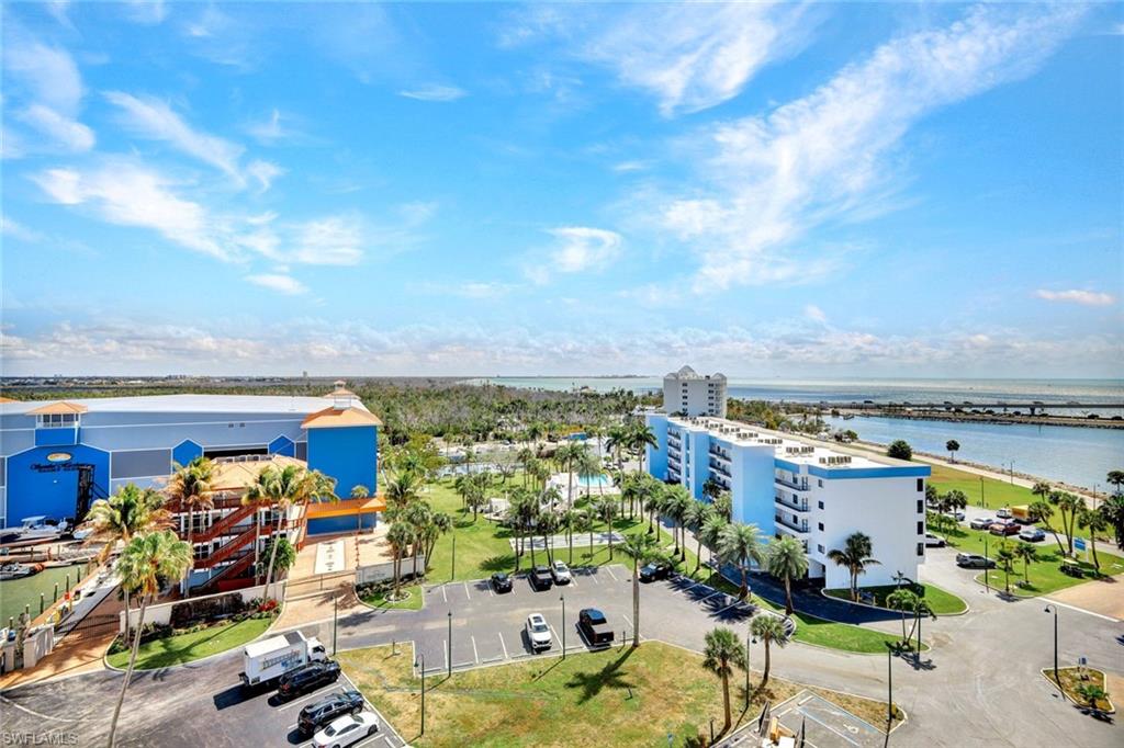 Bird's eye view of a large body of water and apartment complex