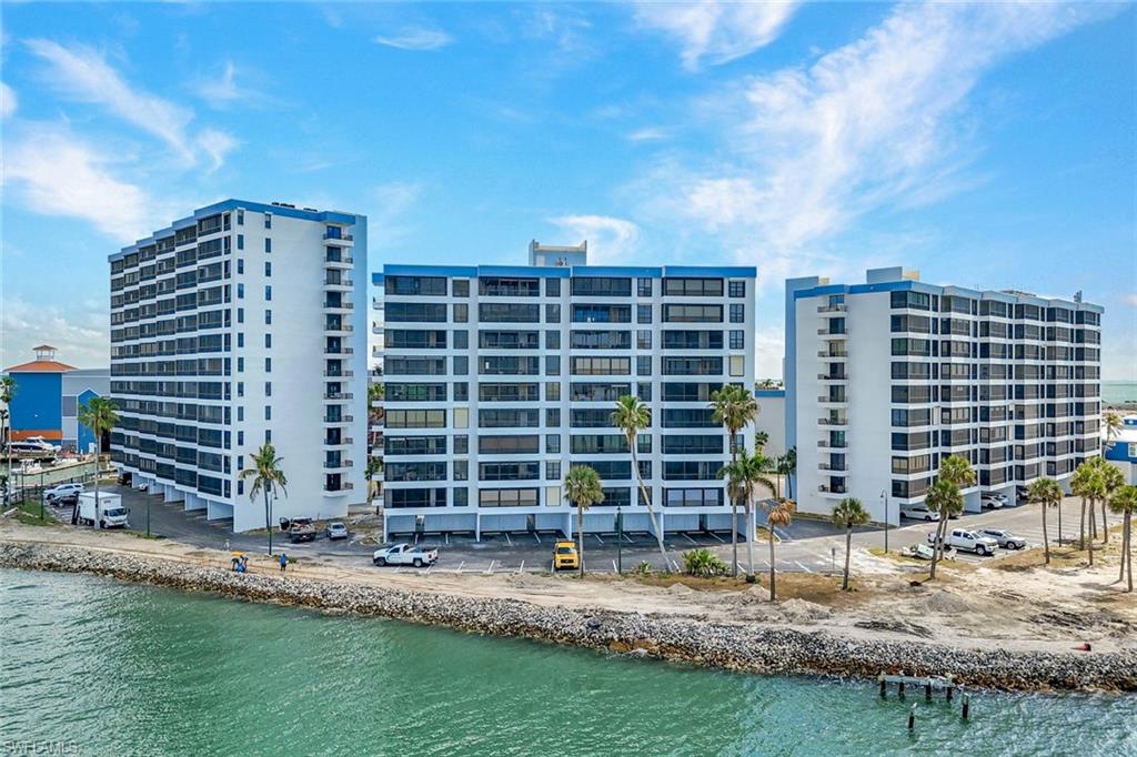 View of apartment building / complex with a water view