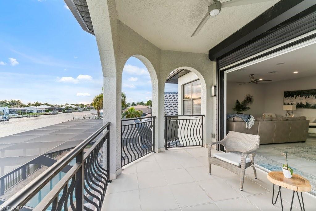 Balcony with ceiling fan and a residential view