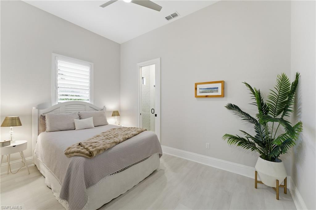 Bedroom with light wood-type flooring and ceiling fan