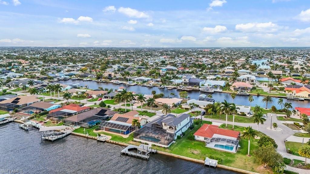 Aerial view of residential area featuring a large body of water