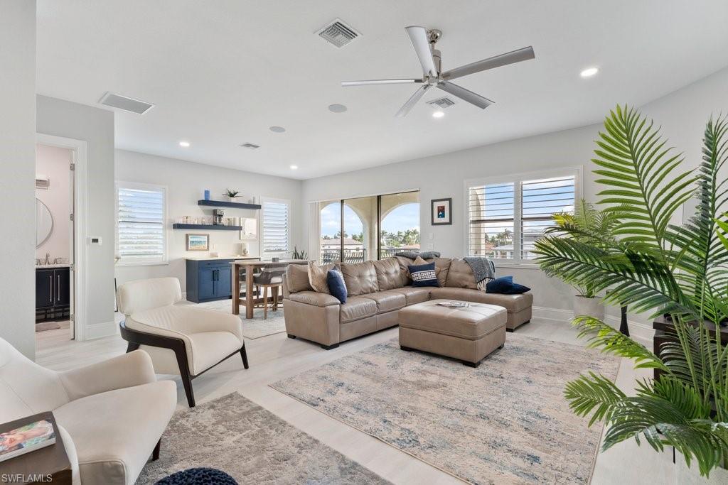 Living area with ceiling fan and recessed lighting