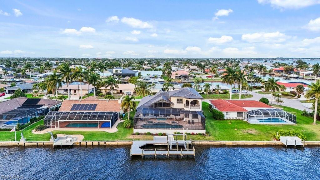 Aerial view of residential area with a nearby body of water