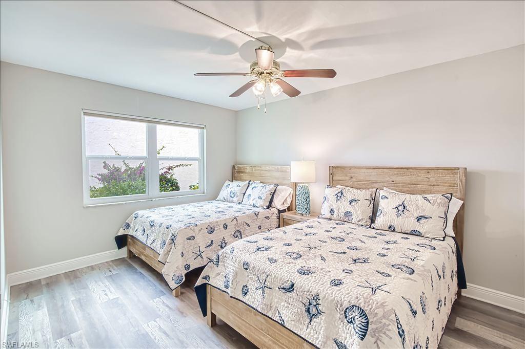 Bedroom featuring light wood-style floors and a ceiling fan