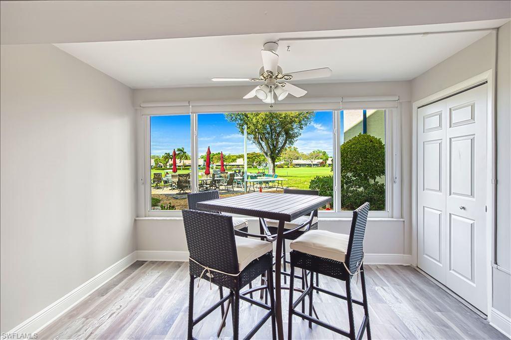 Dining room featuring healthy amount of natural light, light wood-style flooring, and a ceiling fan