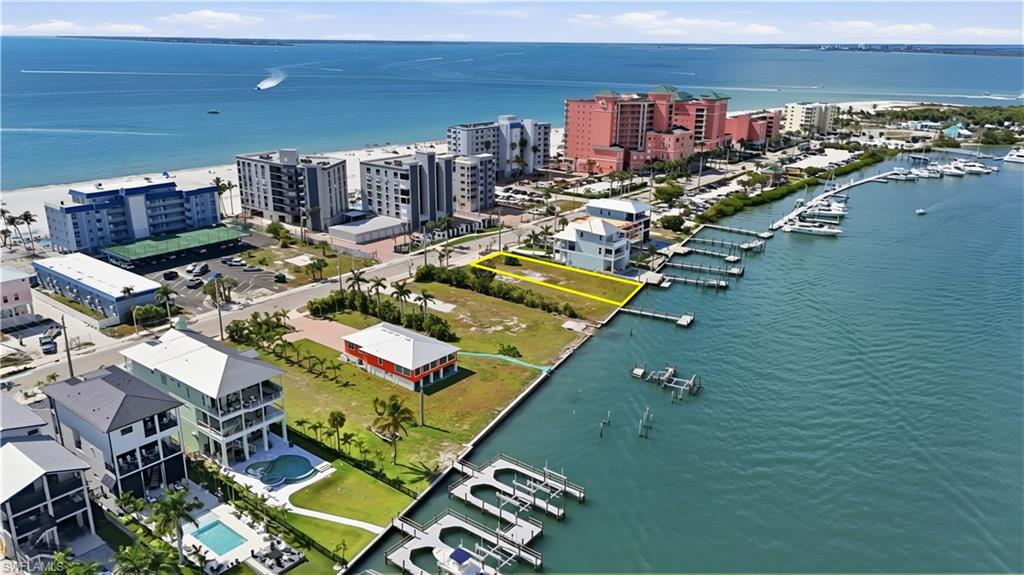 View of urban area with a large body of water and a marina - Virtually Edited Image