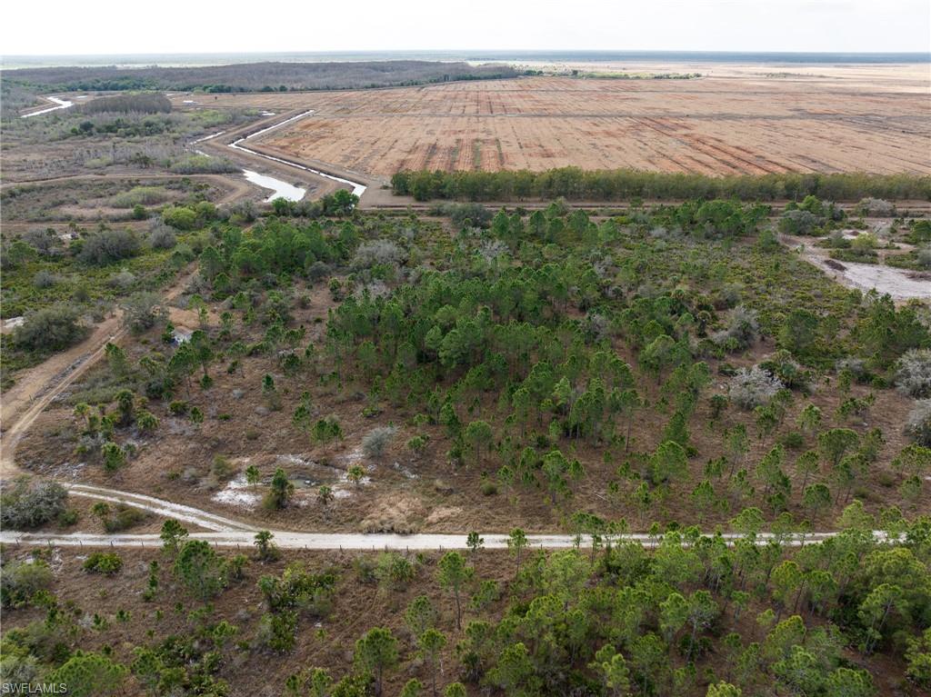 Aerial view of sparsely populated area featuring farmland