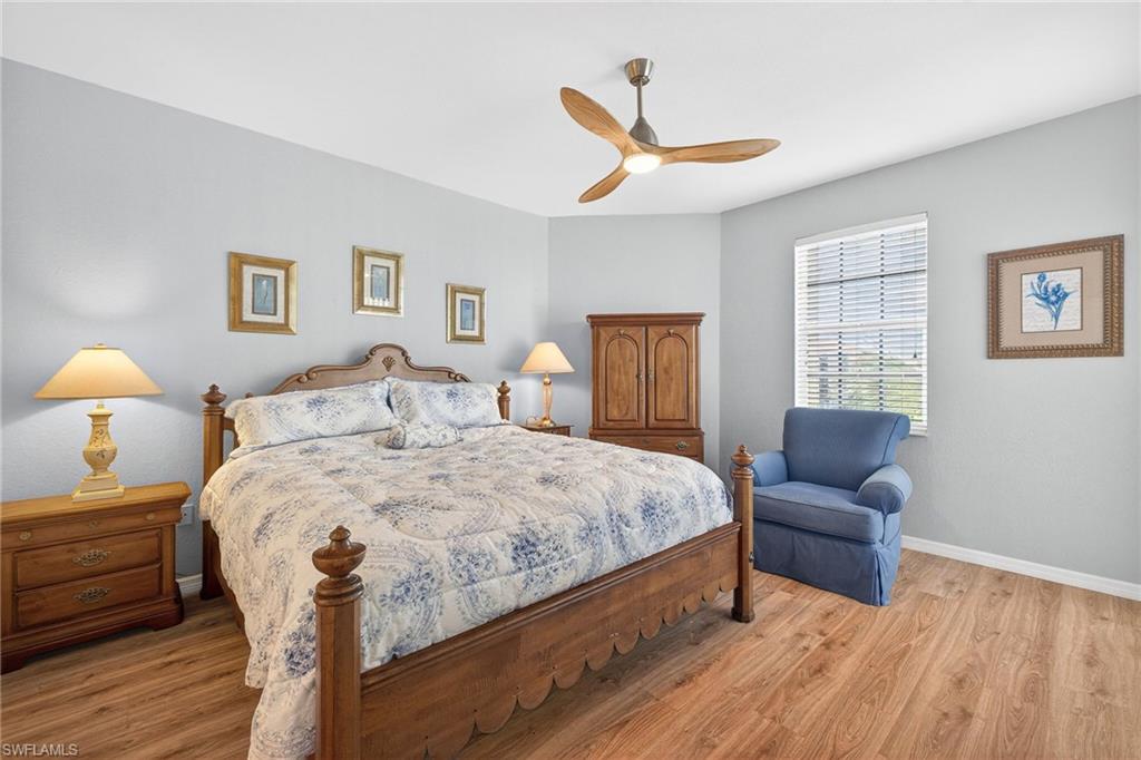 Bedroom featuring light wood finished floors and a ceiling fan