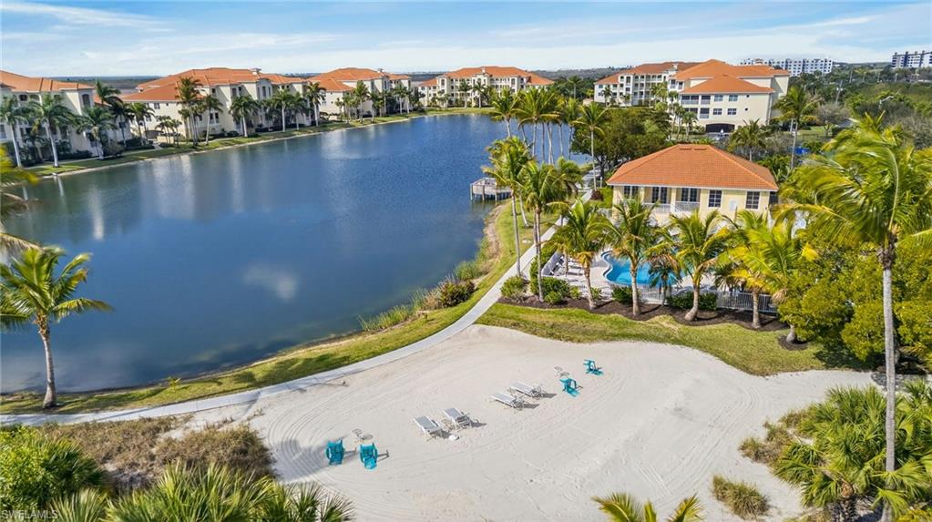 Drone / aerial view of a large body of water and a pool area