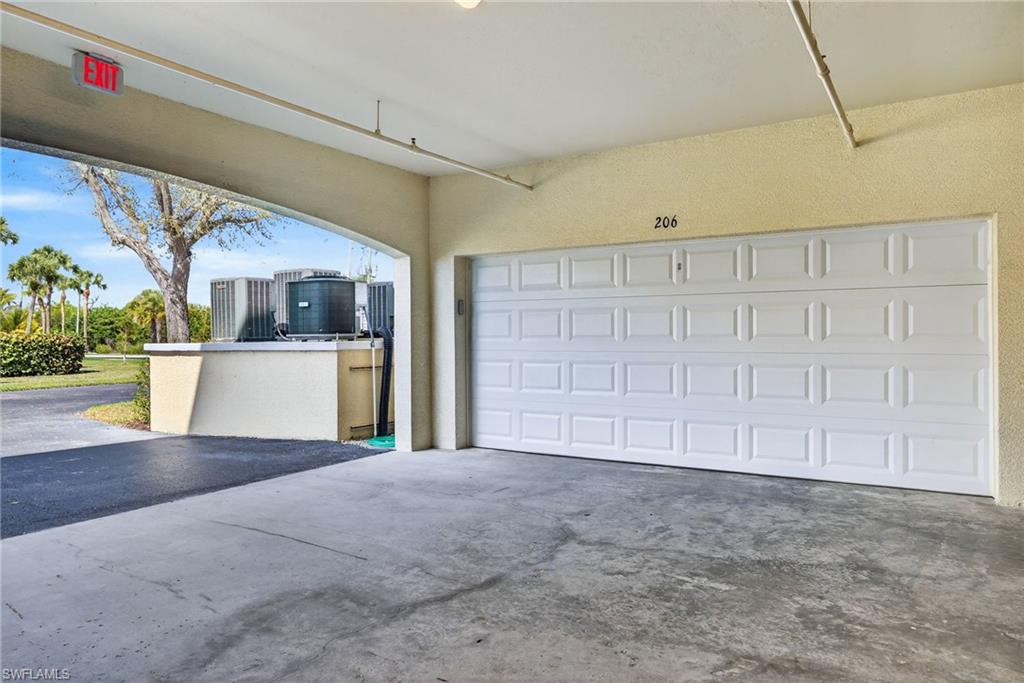 Garage featuring driveway