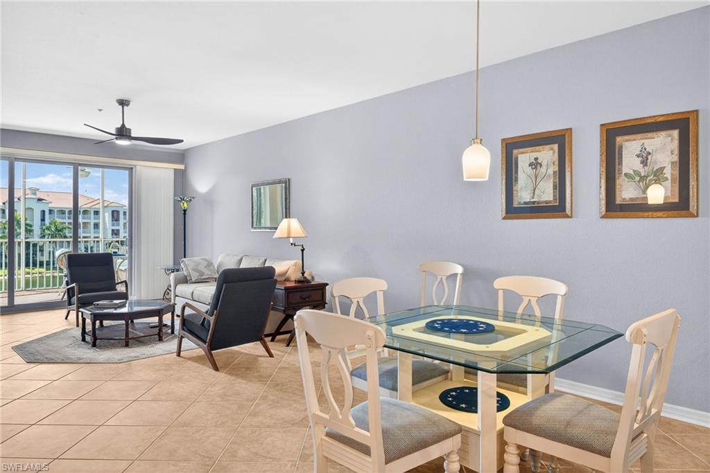 Dining room with ceiling fan and light tile patterned floors