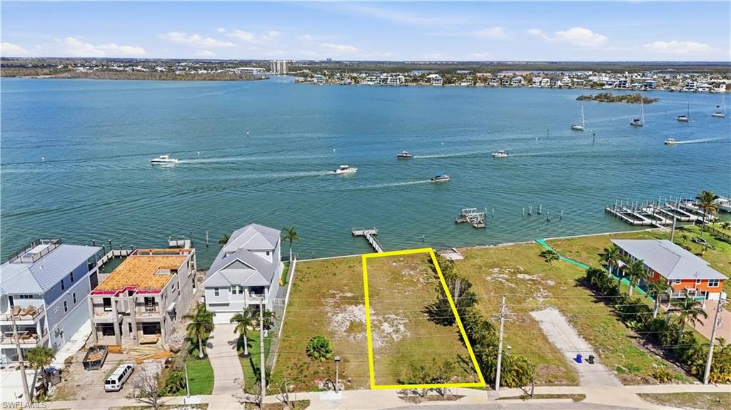 Aerial view of residential area with property boundaries highlighted - Virtually Edited Image