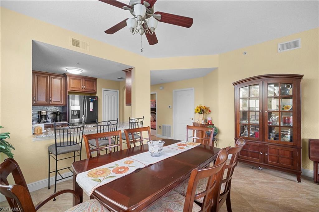 Dining area with baseboards and ceiling fan