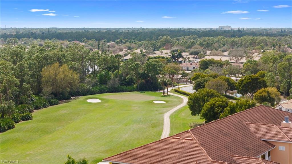 Aerial view of residential area featuring a local golf course