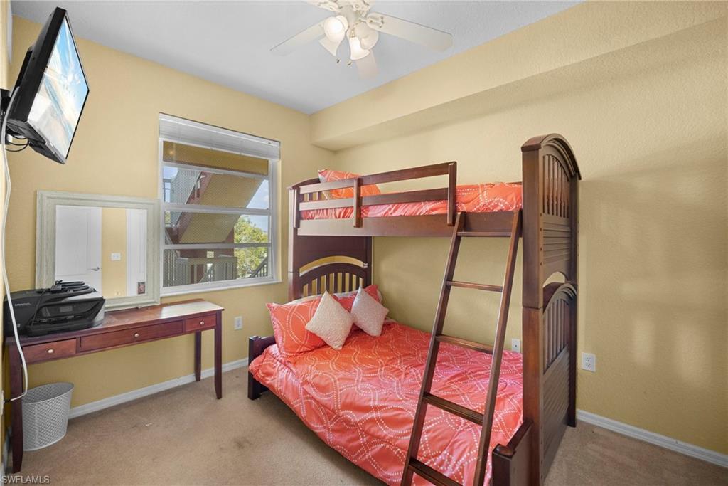 Bedroom with light colored carpet and ceiling fan