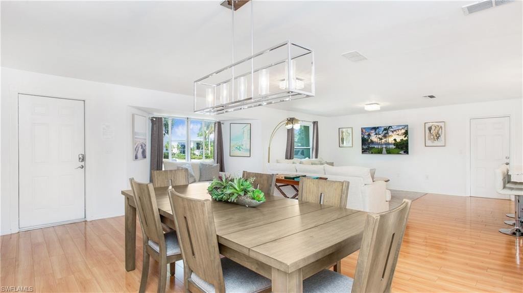 Dining space with light wood-style flooring