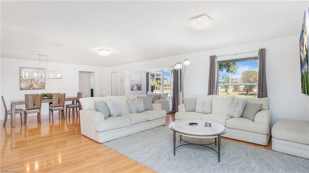 Living room with light wood-style flooring
