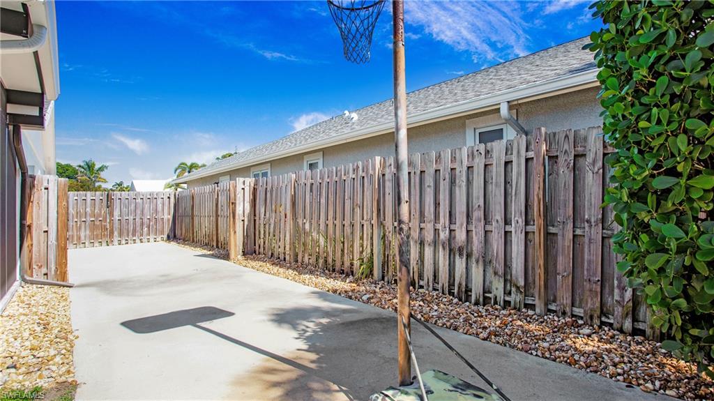 Fenced backyard featuring a patio