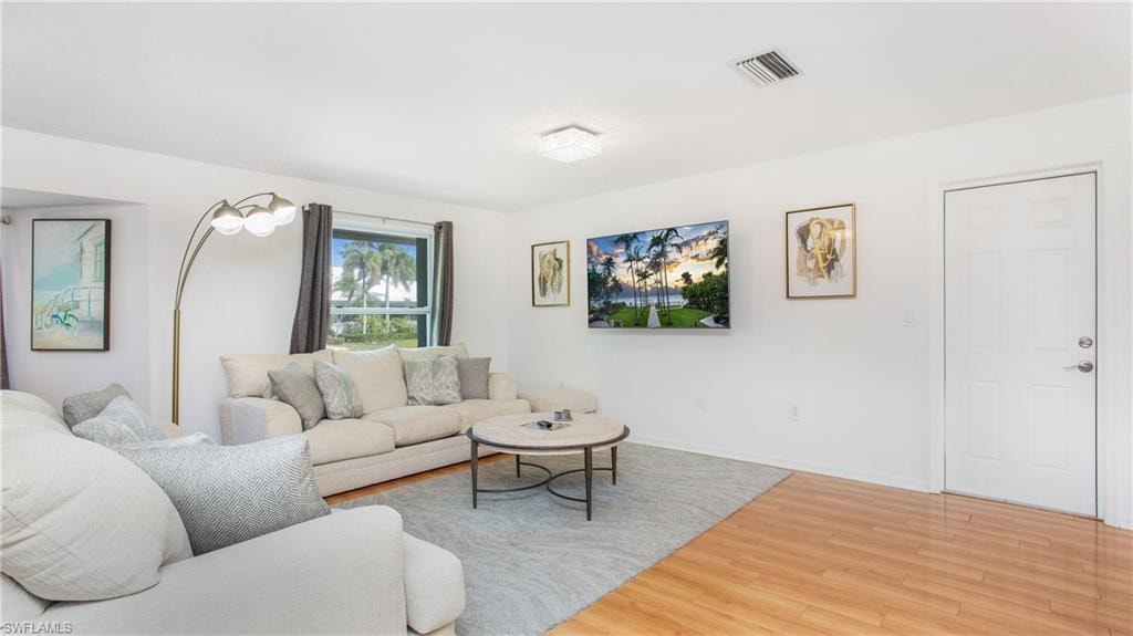 Living room with wood finished floors and baseboards
