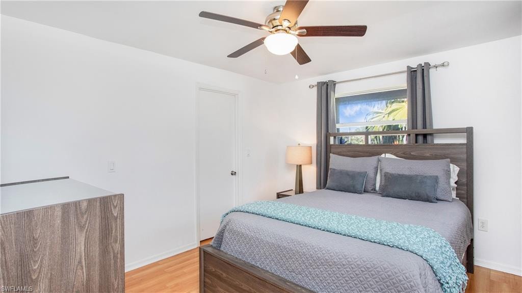 Bedroom featuring light wood-type flooring and a ceiling fan
