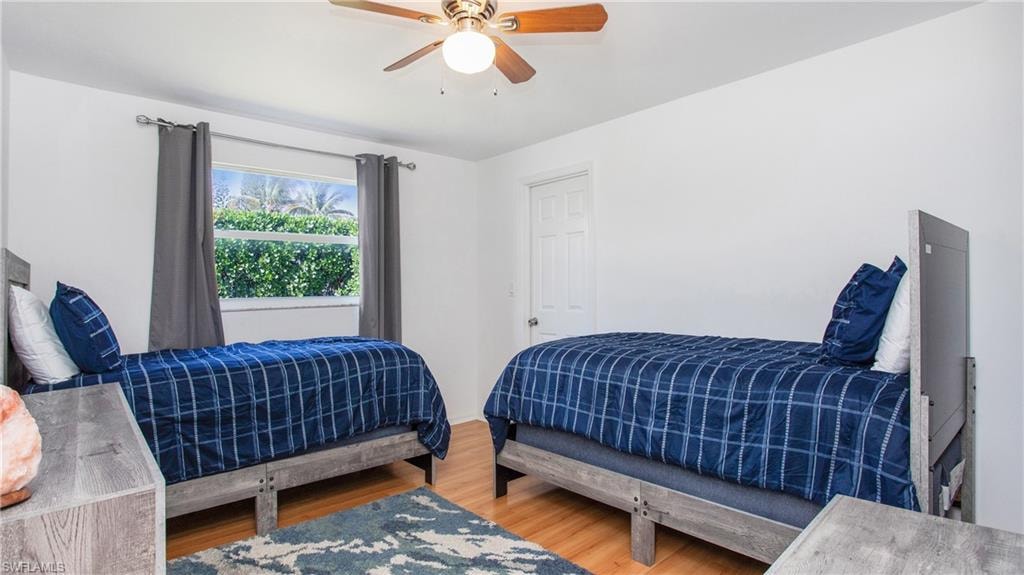 Bedroom with light wood-type flooring and ceiling fan