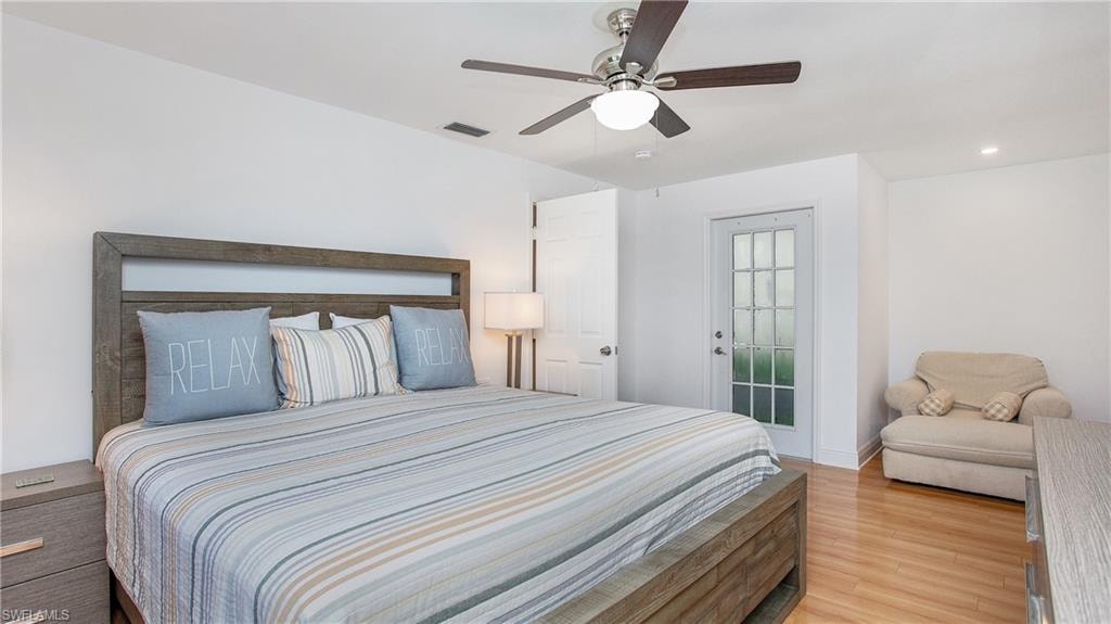 Bedroom featuring light wood-style floors, ceiling fan, and recessed lighting