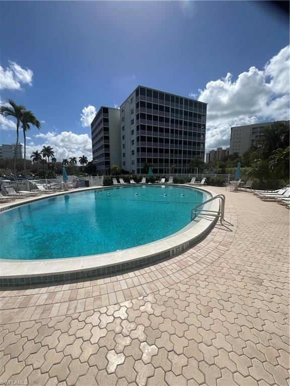 Community pool featuring a patio area