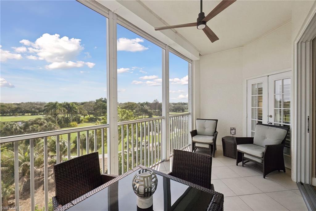Screened balcony mania overlooking golf course and water
