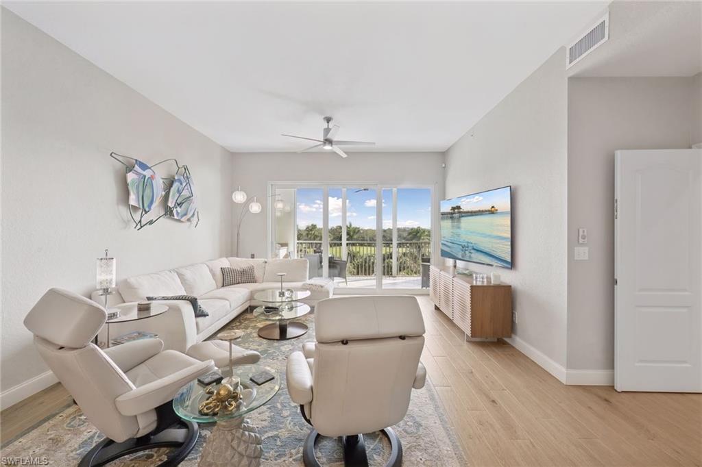 Living room with views of golf course