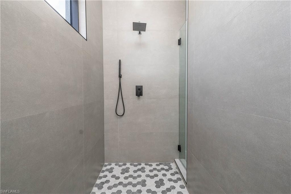 Full bathroom with a stall shower /