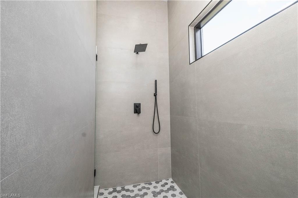Bathroom featuring a tile shower