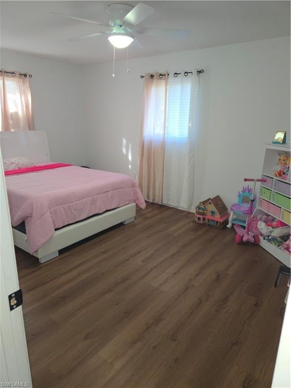 Bedroom featuring dark wood-style floors and a ceiling fan