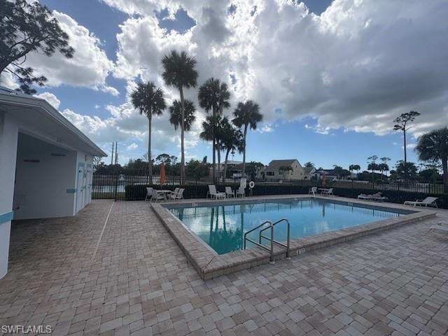 Community pool featuring a patio area