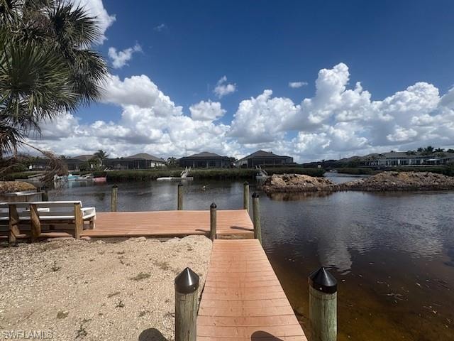 Dock area featuring a water view