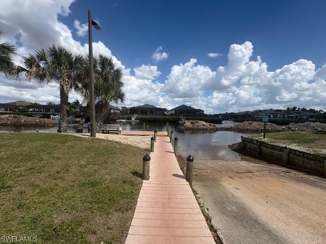 Dock area featuring a boat ramp and a water view