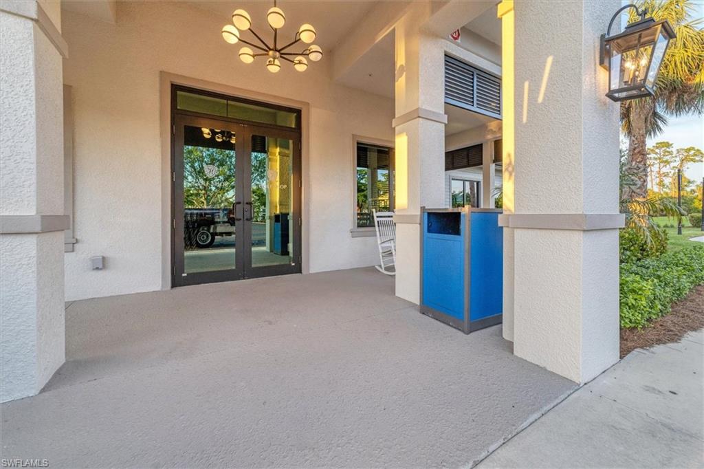Doorway to property featuring french doors, a patio area, and stucco siding