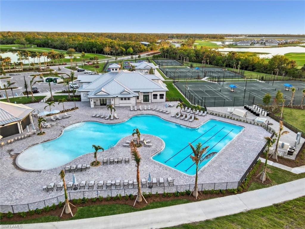 Community pool with a patio and a water view