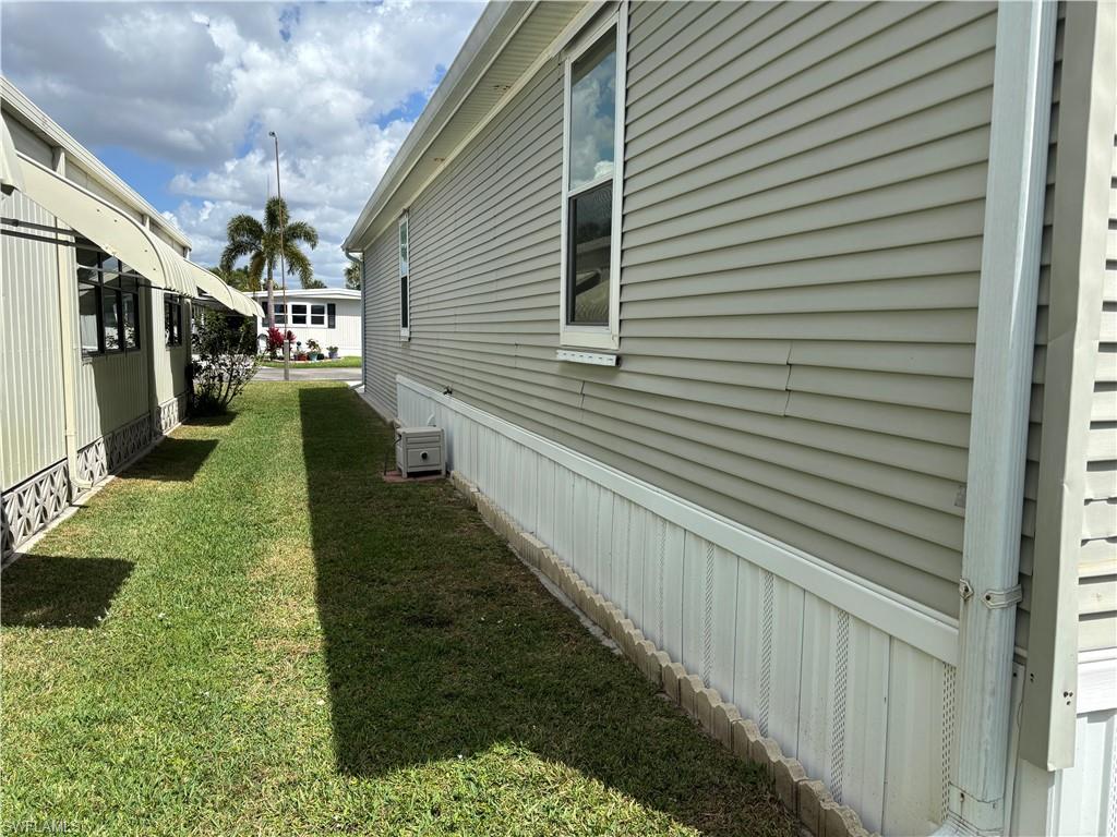 View of home's exterior with a lawn