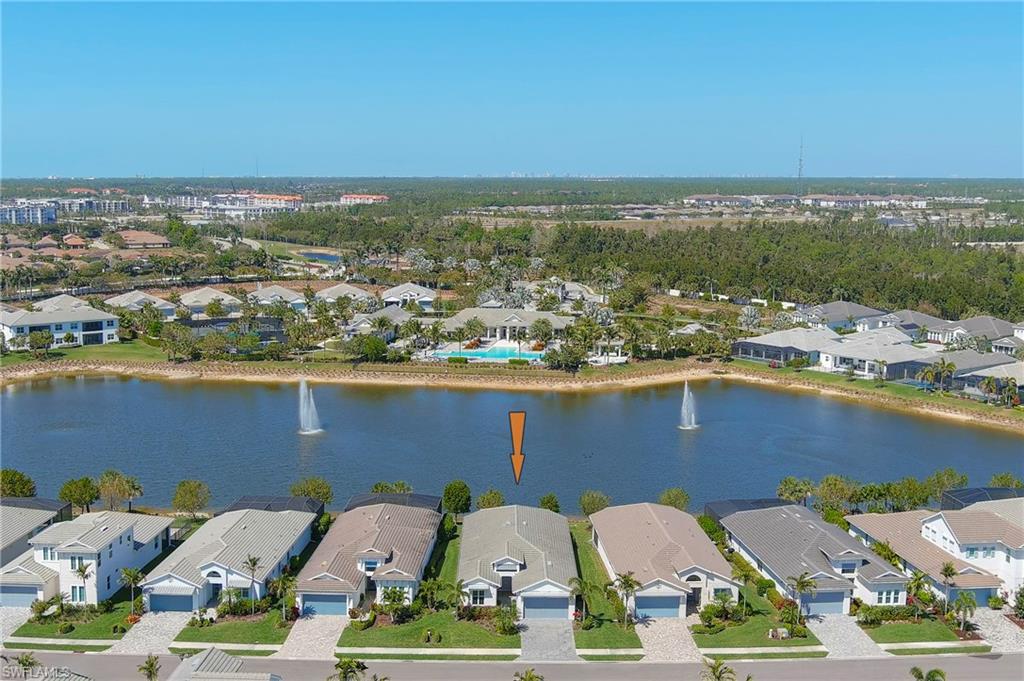 Aerial view of residential area with a large body of water