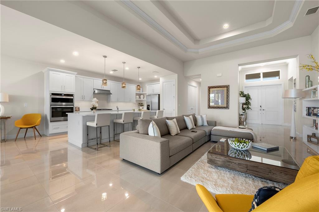 Living room featuring recessed lighting and light tile patterned flooring