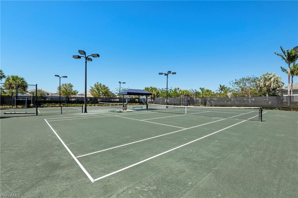 View of tennis court featuring a gazebo
