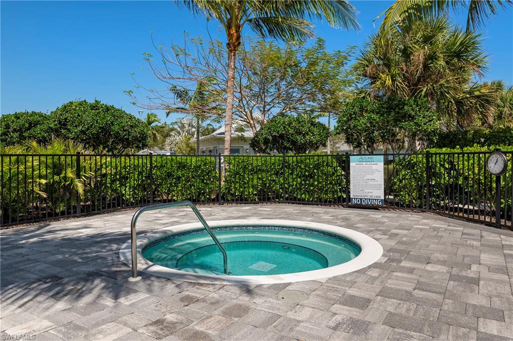 View of pool with a community hot tub