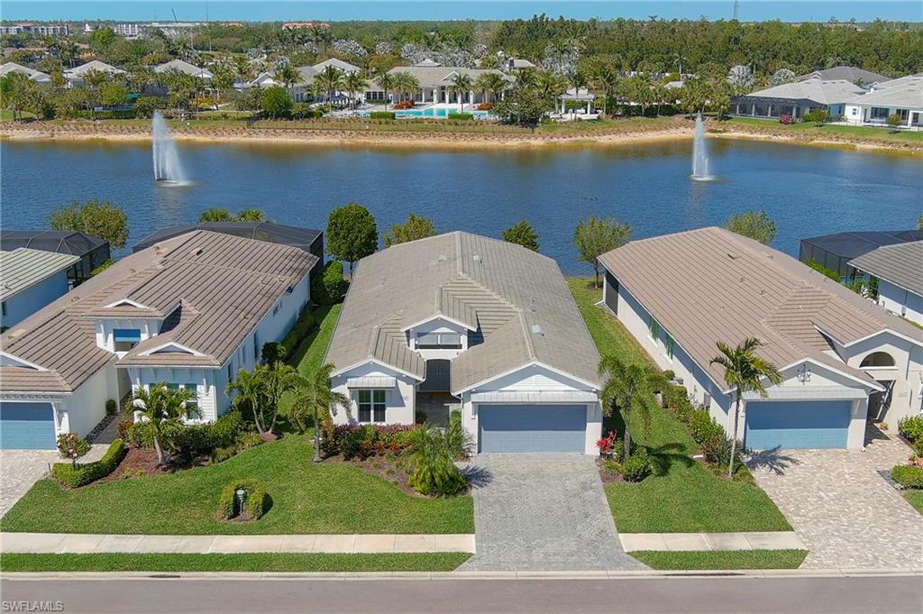 Aerial view of residential area featuring a large body of water