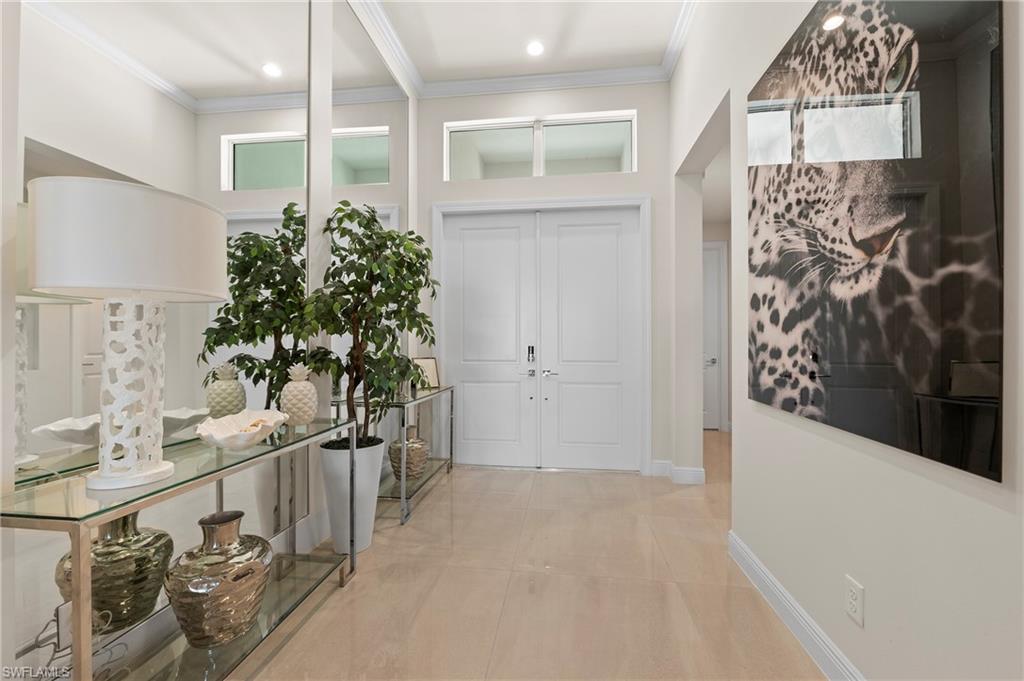 Foyer entrance featuring ornamental molding