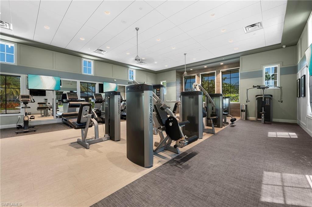 Gym with recessed lighting and a ceiling fan