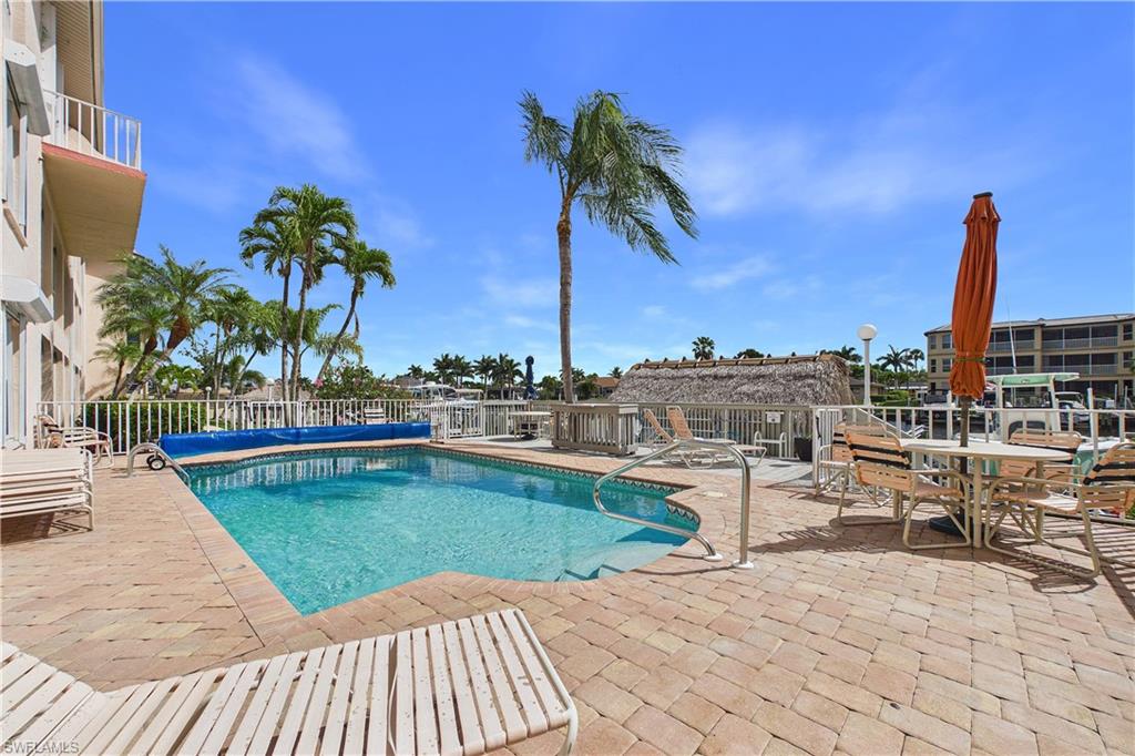 View of heated pool featuring large patio surround