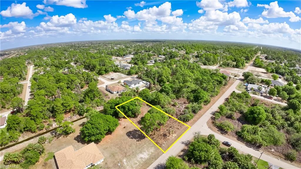 Aerial perspective of suburban area with property parcel outlined