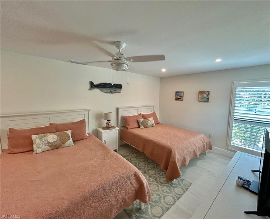 Guest bedroom featuring a ceiling fan and recessed lighting