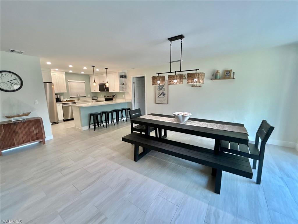 Dining room with baseboards and recessed lighting