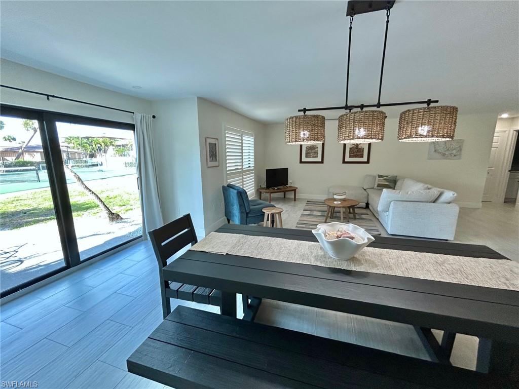 Dining space with baseboards and light flooring